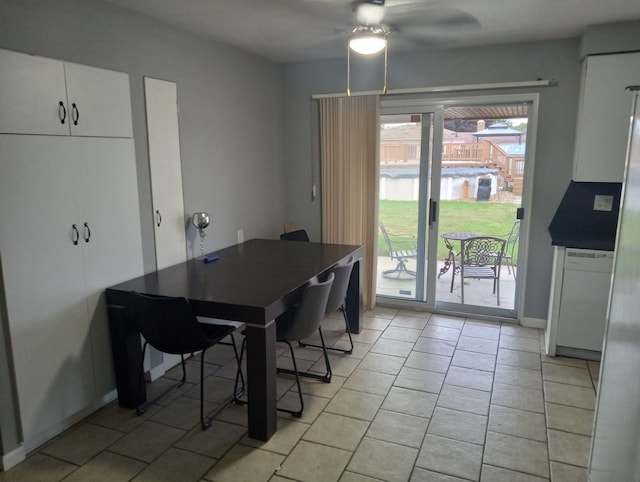 dining area featuring ceiling fan and light tile patterned floors