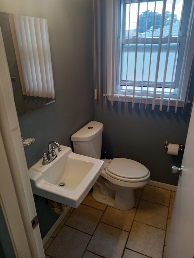 bathroom with tile patterned floors, toilet, and sink