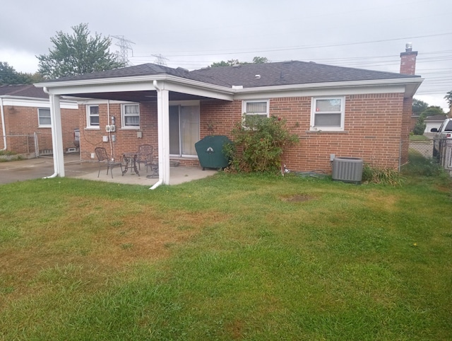 back of house with a yard, a patio, and cooling unit