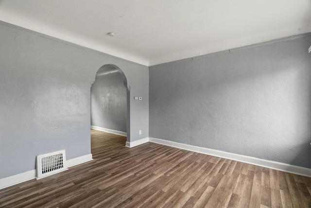 unfurnished room featuring dark hardwood / wood-style floors