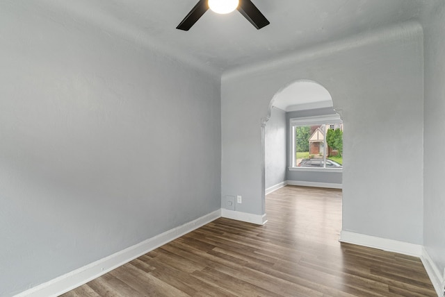 empty room with ceiling fan and hardwood / wood-style floors