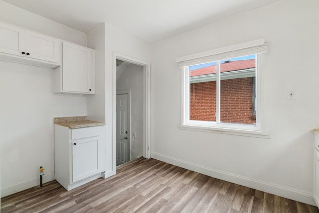 unfurnished dining area featuring light hardwood / wood-style floors