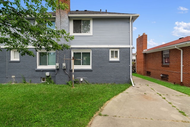 view of property exterior with a yard