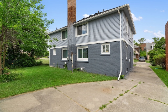 rear view of house with a lawn