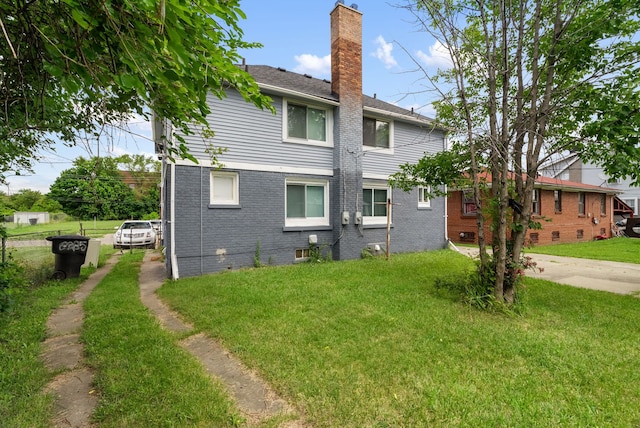 view of property exterior featuring a yard