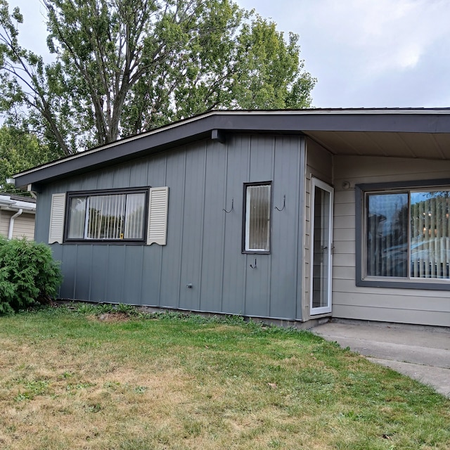 view of property exterior featuring a yard