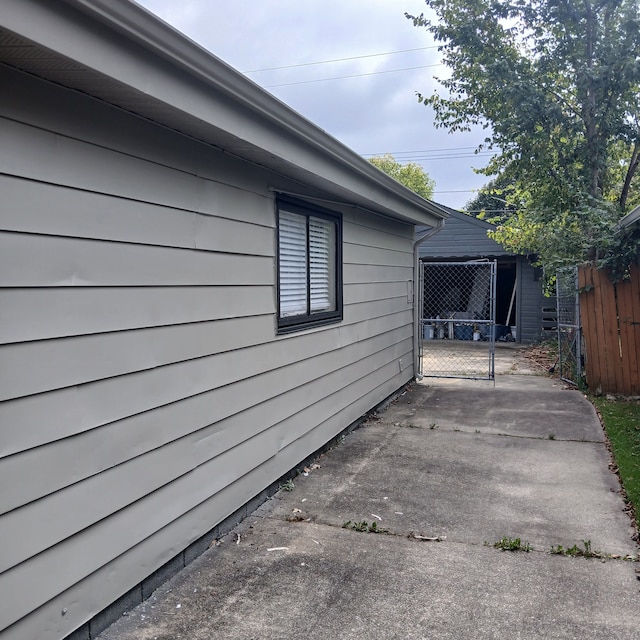 view of side of home featuring a patio area