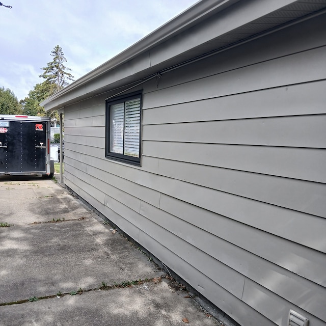 view of property exterior featuring a patio