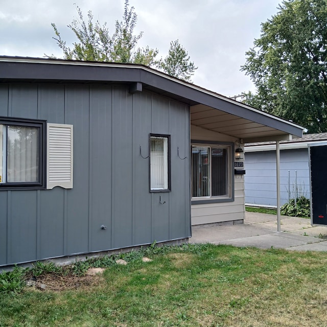 view of side of property with a yard