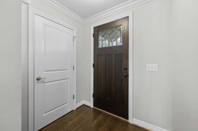 entryway with dark wood-type flooring and ornamental molding