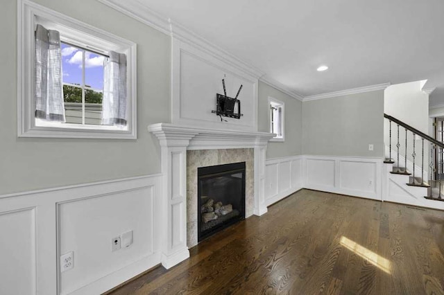 unfurnished living room with dark hardwood / wood-style flooring and crown molding