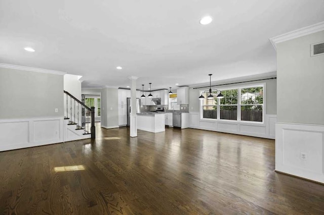 unfurnished living room featuring dark hardwood / wood-style floors and crown molding