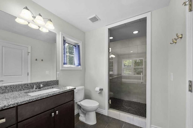 bathroom with tile patterned floors, a chandelier, an enclosed shower, toilet, and vanity