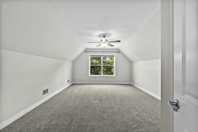 additional living space with carpet, vaulted ceiling, and ceiling fan