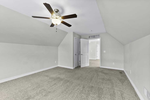 bonus room with ceiling fan, carpet floors, and vaulted ceiling