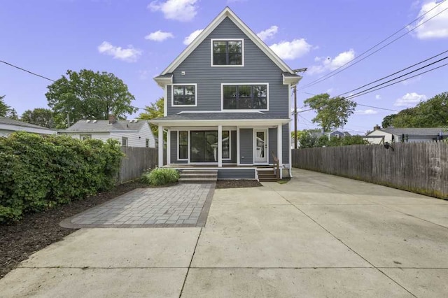 back of property with a patio and a porch