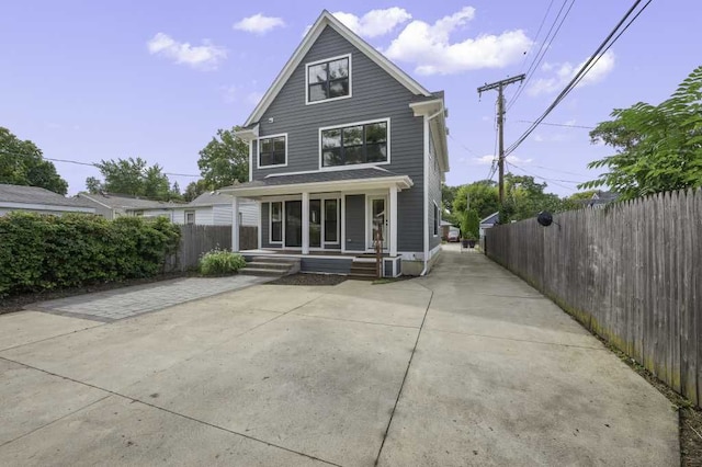 back of property featuring a porch