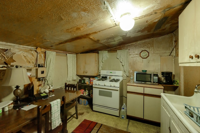 kitchen featuring white gas range