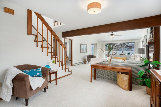 1875 Edwin Dr, Wayland, MI 49348 - living room featuring a baseboard radiator, light colored carpet, a ceiling fan, beamed ceiling, and stairway