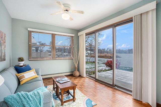 1875 Edwin Dr, Wayland, MI 49348 - living area featuring baseboard heating and ceiling fan