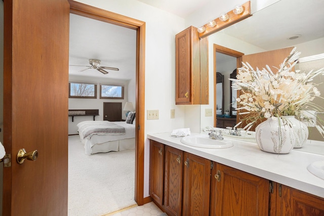bathroom featuring ceiling fan and vanity