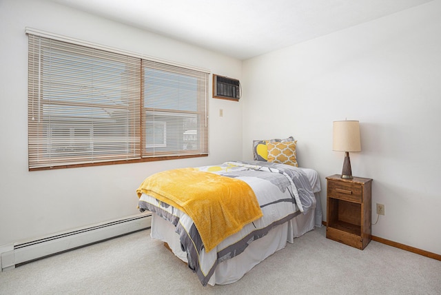 1875 Edwin Dr, Wayland, MI 49348 - bedroom with a baseboard radiator, light carpet, a wall mounted air conditioner, and baseboards