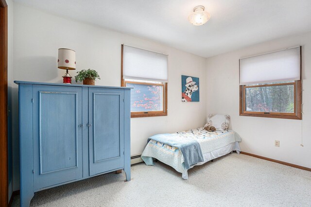 1875 Edwin Dr, Wayland, MI 49348 - bedroom featuring carpet floors, baseboards, and a baseboard radiator