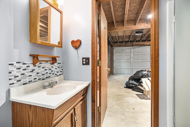 1875 Edwin Dr, Wayland, MI 49348 - bathroom featuring unfinished concrete flooring, vanity, and decorative backsplash