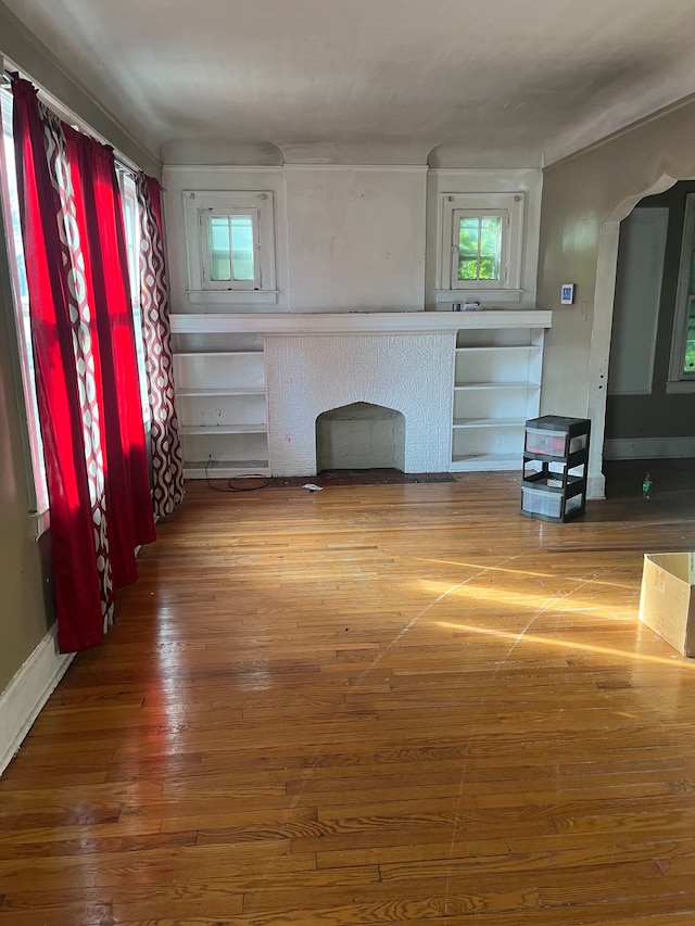 unfurnished living room featuring hardwood / wood-style floors