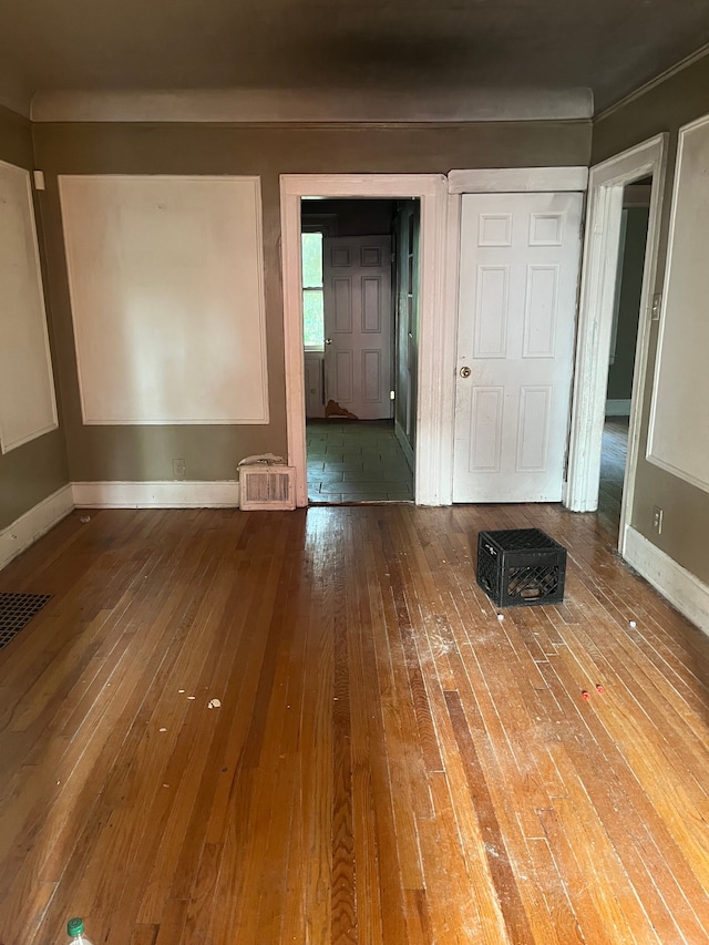 unfurnished room featuring hardwood / wood-style flooring