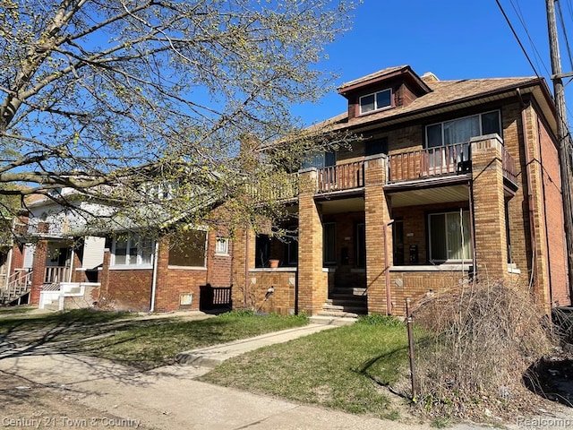 view of front of home with a balcony