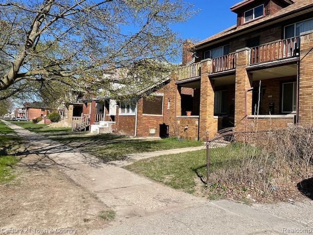 view of home's exterior featuring a balcony