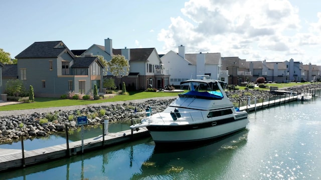 267 Keelson Dr, Detroit, MI 48215 - dock area with a residential view, a water view, and a lawn