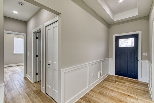 foyer entrance with light hardwood / wood-style flooring