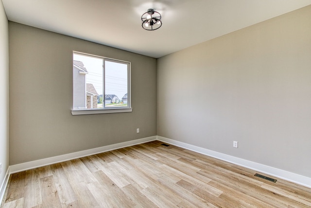 empty room with light wood-type flooring