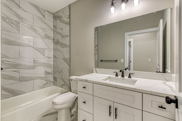 full bathroom featuring vanity, tiled shower / bath combo, and toilet