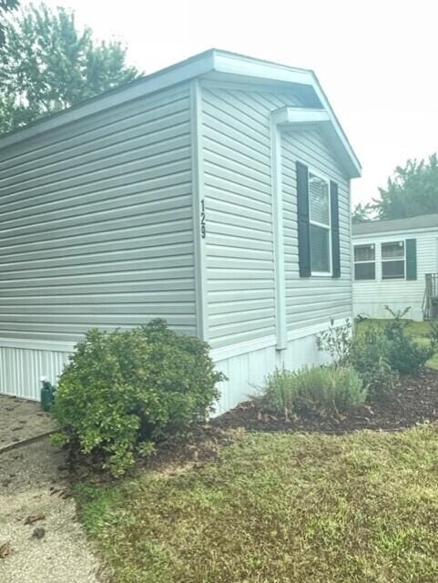 view of home's exterior featuring a yard