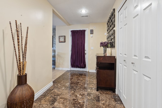 interior space with a textured ceiling