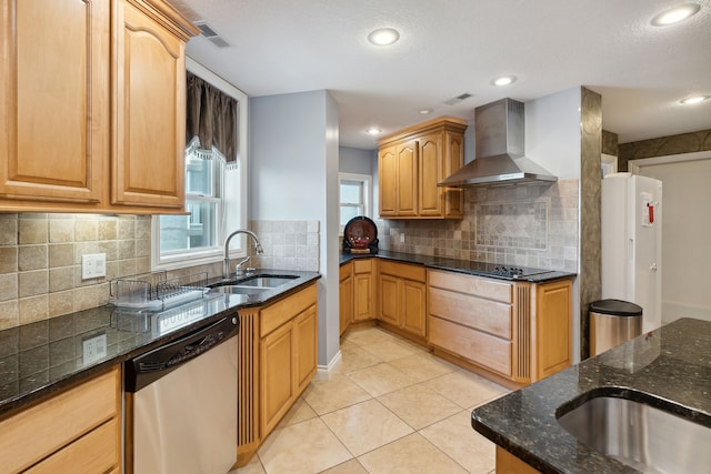 kitchen featuring black electric cooktop, sink, wall chimney range hood, light tile patterned floors, and dishwasher