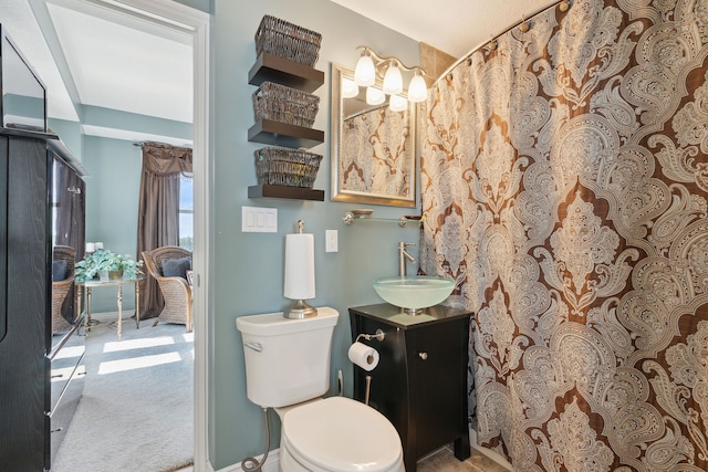 bathroom with vanity and toilet