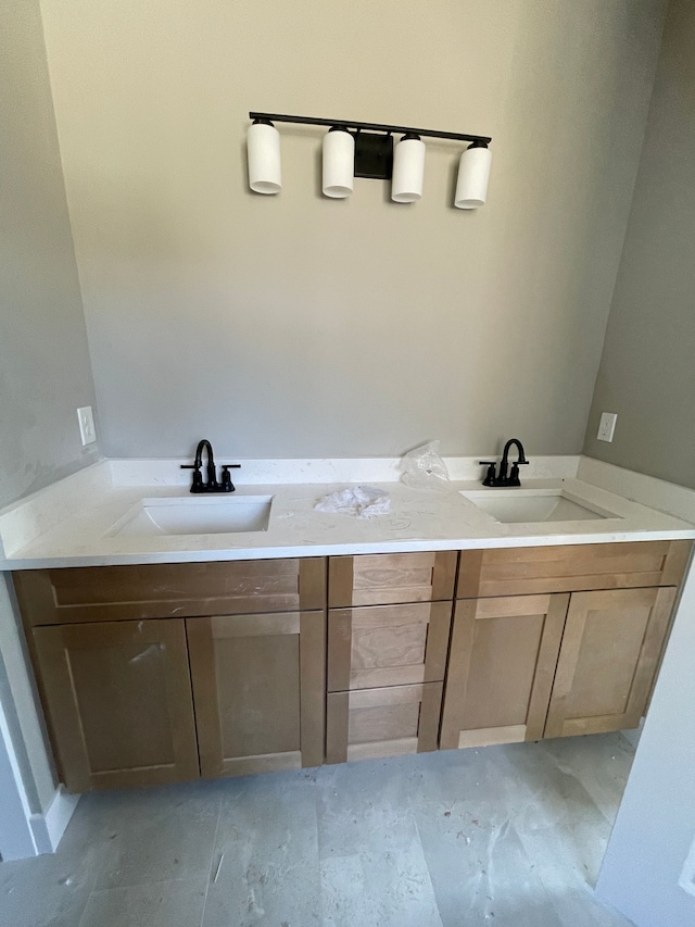 bathroom featuring double vanity and a sink