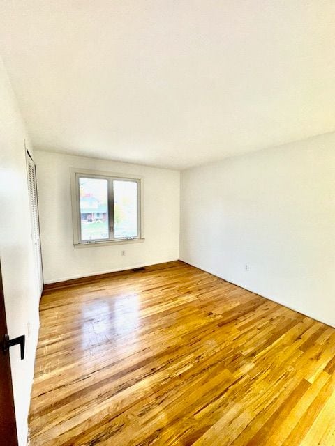 spare room featuring light wood-type flooring