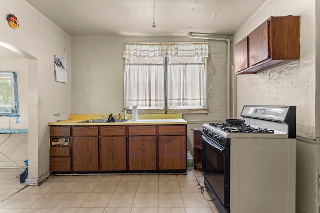 kitchen featuring range with gas stovetop and sink