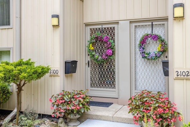 2100 Hyde Park Rd, Detroit, MI 48207 - doorway to property featuring board and batten siding