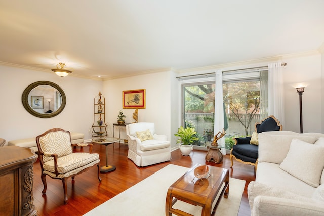 living room with hardwood / wood-style floors and ornamental molding