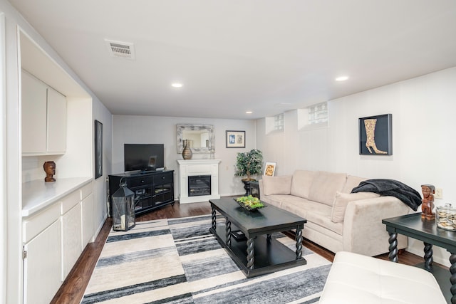 2100 Hyde Park Rd, Detroit, MI 48207 - living area featuring dark wood-style flooring, recessed lighting, and a glass covered fireplace