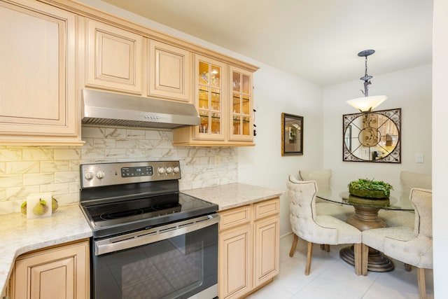 kitchen with decorative backsplash, light stone counters, light tile patterned floors, decorative light fixtures, and stainless steel range with electric cooktop