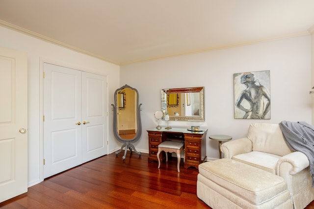 sitting room with crown molding and dark hardwood / wood-style flooring