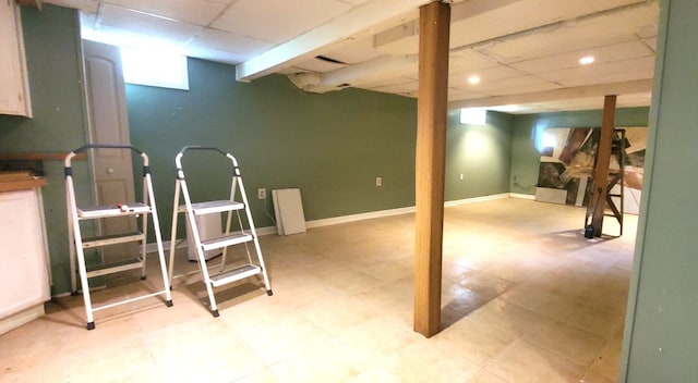 basement featuring a drop ceiling