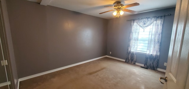 unfurnished room featuring carpet and ceiling fan